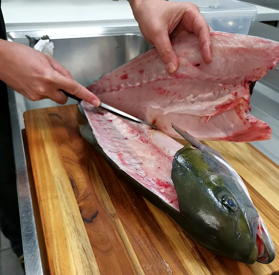 Hamachi being filleted